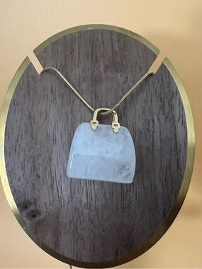 Clear quartz purse pendant plus a gold plated necklace